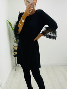 Black feather sleeve dress